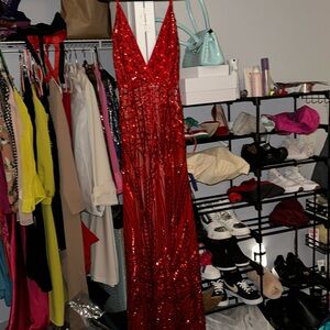 This crystal red gown by Alamour is gorgeous with sequins trailing down. Xs